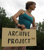 woman holding "Archive Project" sign